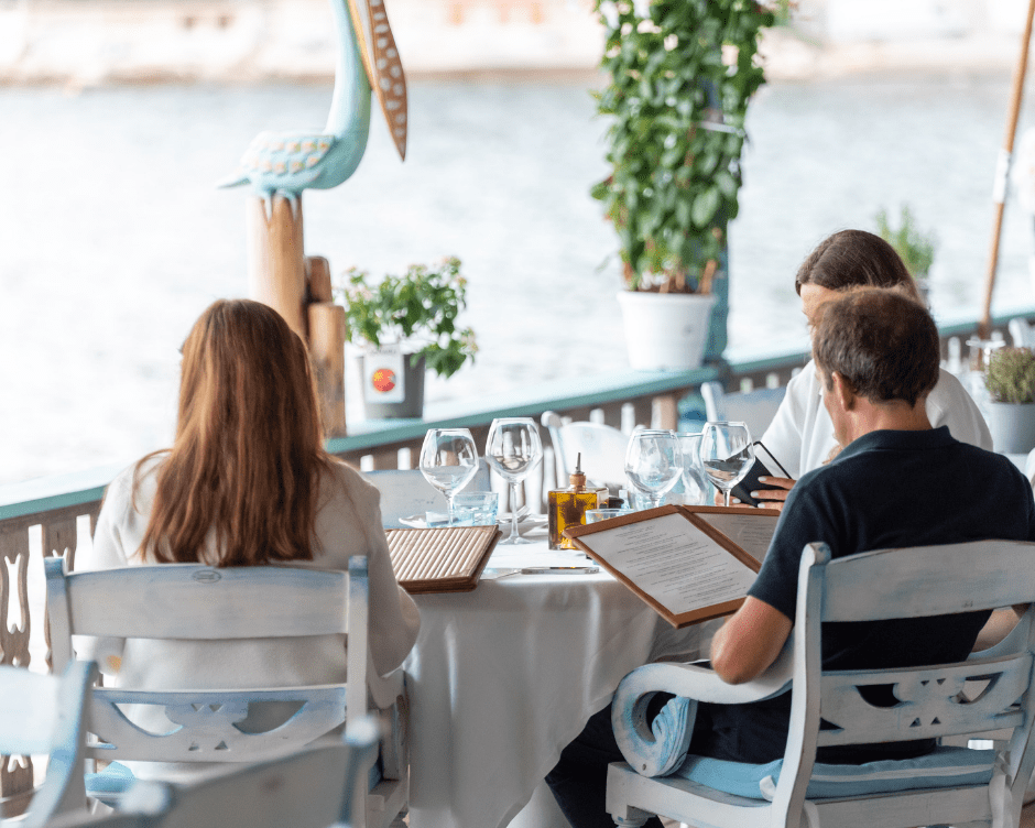 A family chooses their meal overlooking the sea at Anjuna